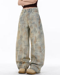 Arc-Cut Distressed Wide-Leg Jeans